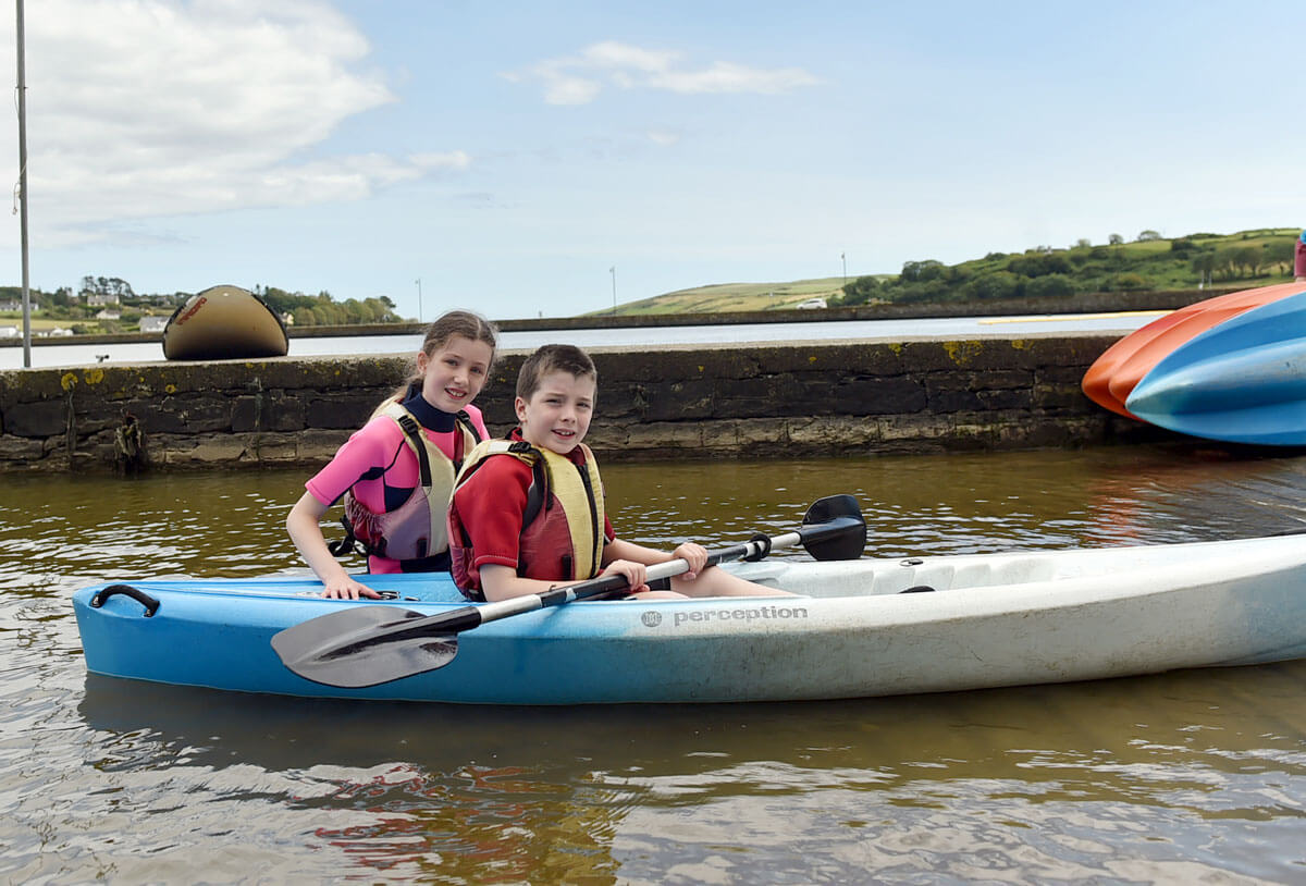Young people kayaking in the Lagoon activity Centre