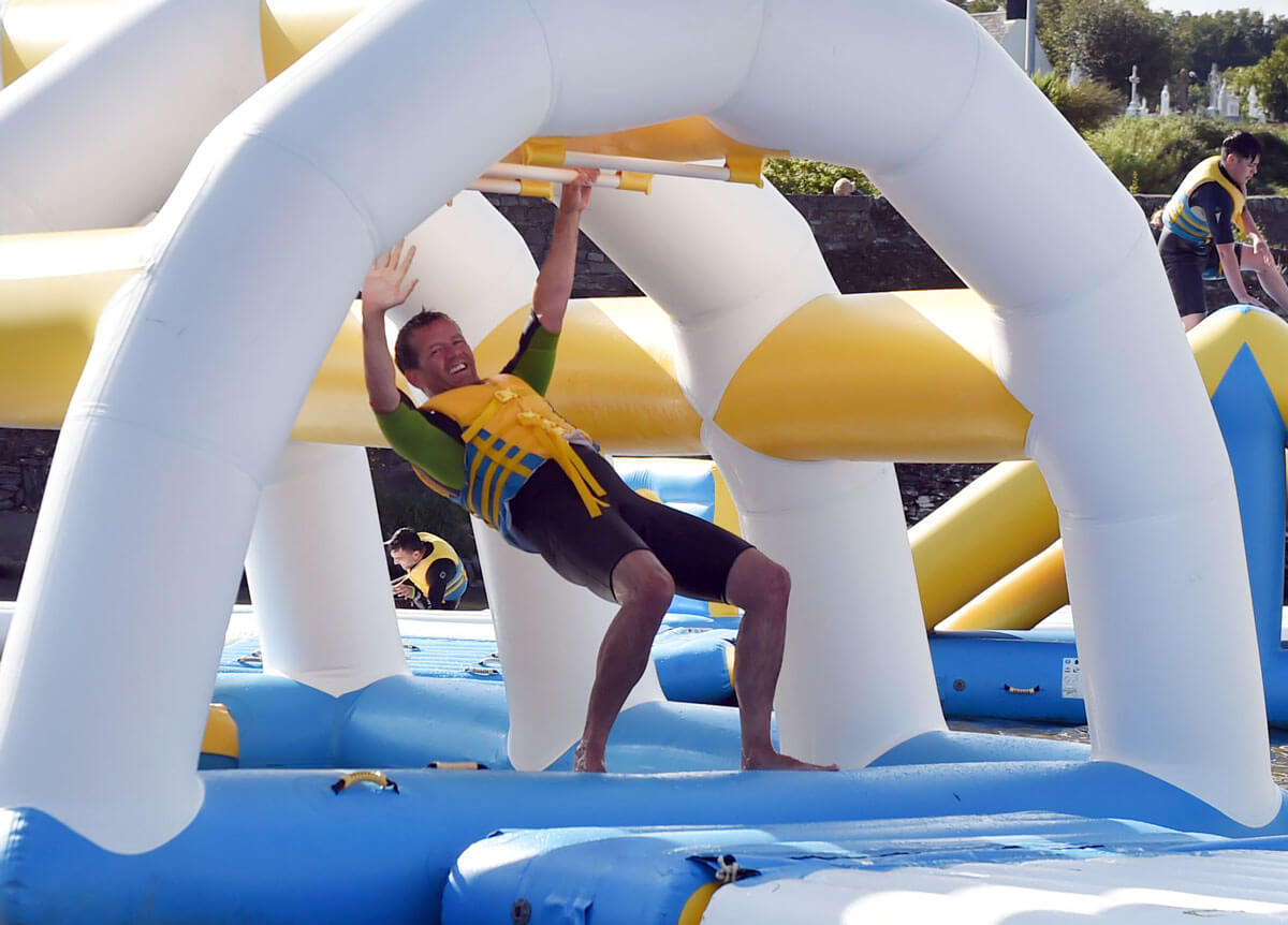 A man trying obstacle course at The Lagoon Activity Centre