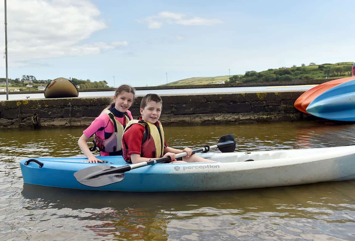 Young people enjoying kayaking in Cork Ireland at Lagoon activity centre