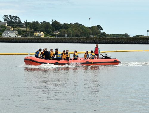 Day tour from Cork with a boat full of people on the way to the water park