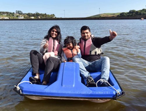 Family enjoying a pedal boat ride at the Lagoon Activity Centre in Rosscarbery, perfect for adventure gift cards.